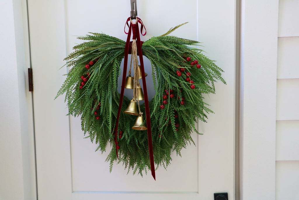 Cascading beaded-grass wreath with red berries, burgundy velvet ribbon and five hanging gold-tone bells.