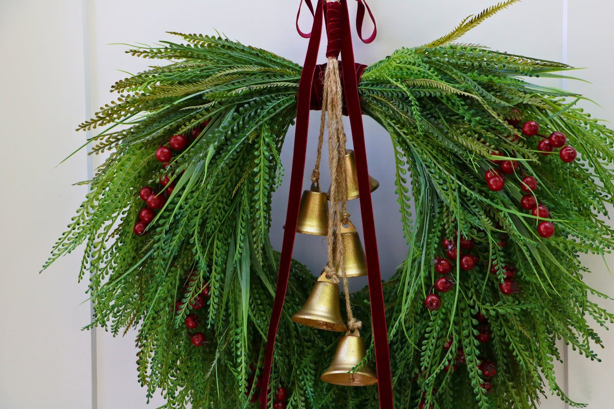 Cascading beaded-grass wreath with red berries, burgundy velvet ribbon and five hanging gold-tone bells.