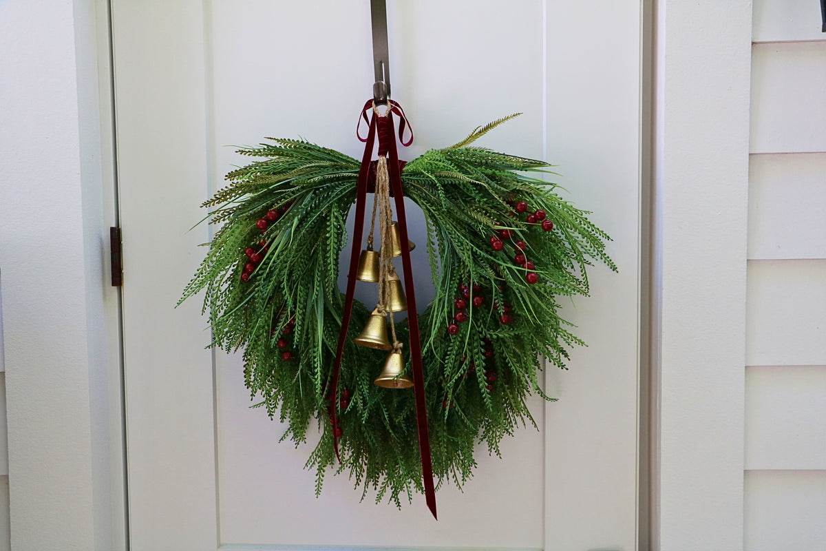 Cascading beaded-grass wreath with red berries, burgundy velvet ribbon and five hanging gold-tone bells.