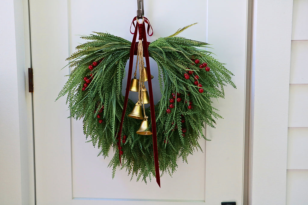 Cascading beaded-grass wreath with red berries, burgundy velvet ribbon and five hanging gold-tone bells.
