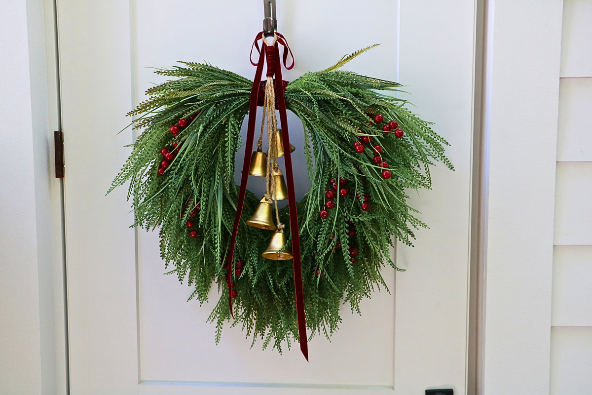 Cascading beaded-grass wreath with red berries, burgundy velvet ribbon and five hanging gold-tone bells.